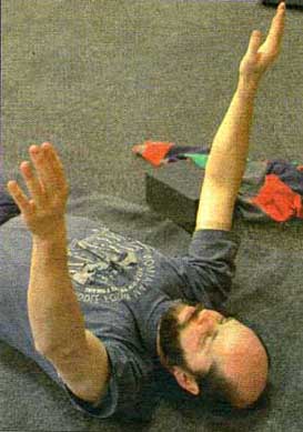 Fr. Ed Novak in a yoga pose